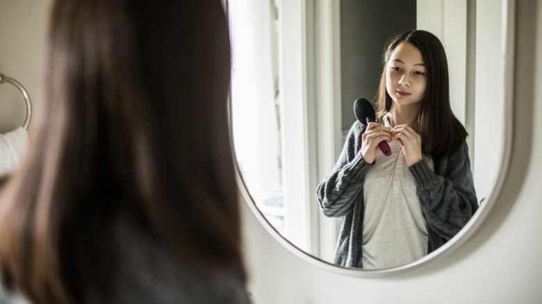 a girl brushing her hair