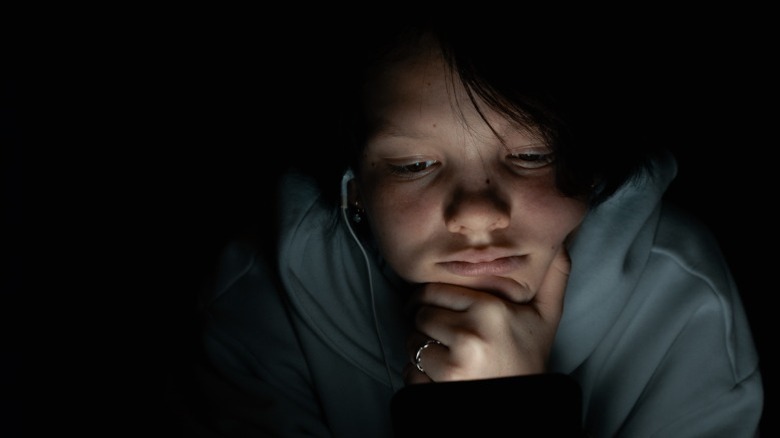 teenage girl using a phone