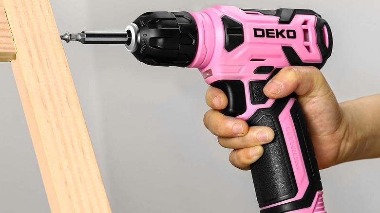 Pink drill used on a screw