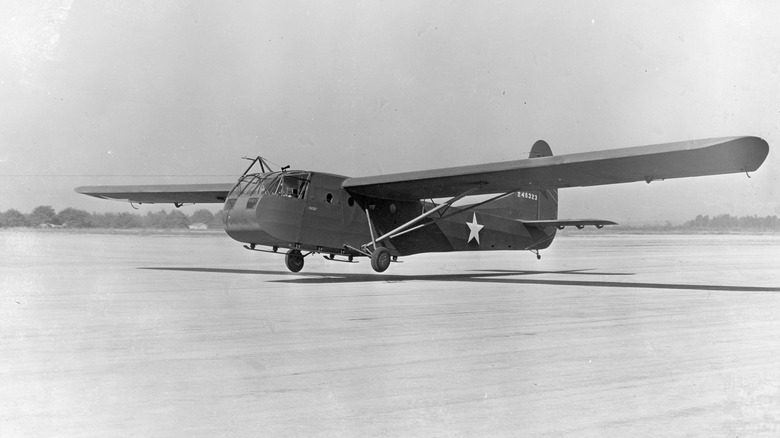 An Army glider from WWII about to land.