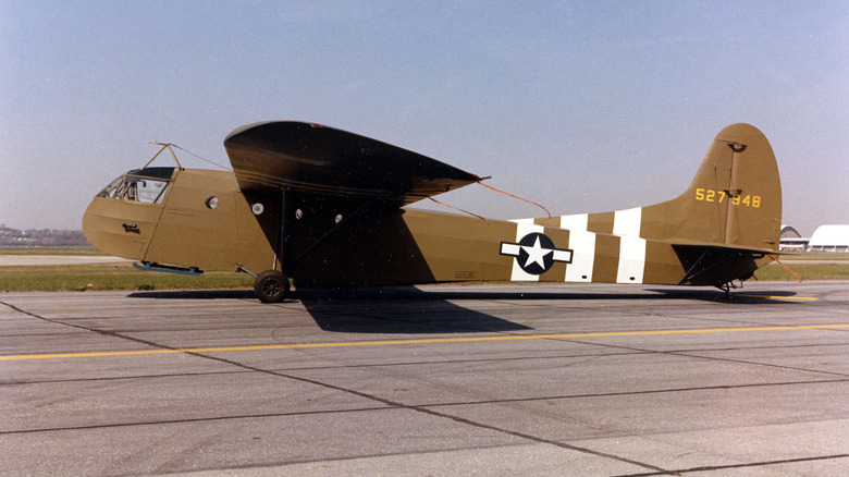 An Army glider from WWII on the tarmac.