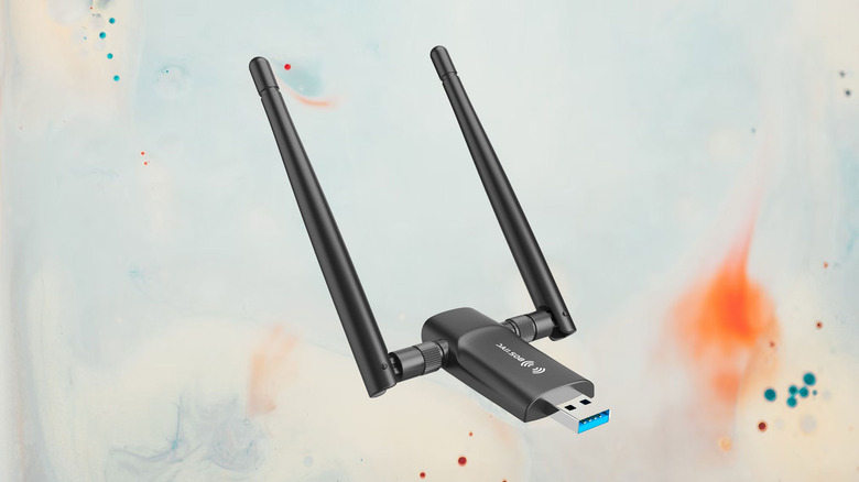 wireless network adapter on a paint splattered background