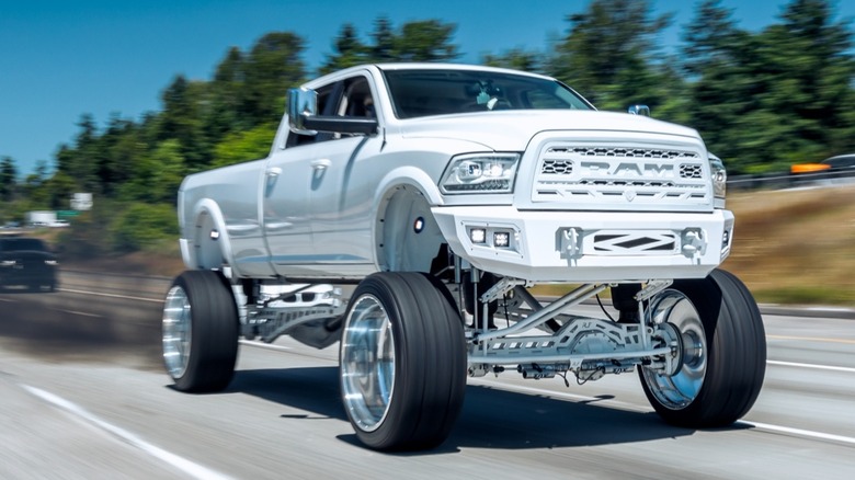 A heavily (and most likely illegally) modified diesel pickup truck "rolling coal."