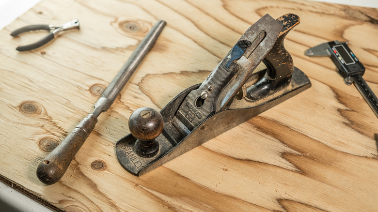 an old Stanley hand plane on wood surface