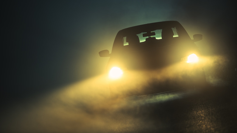 Car driving in fog