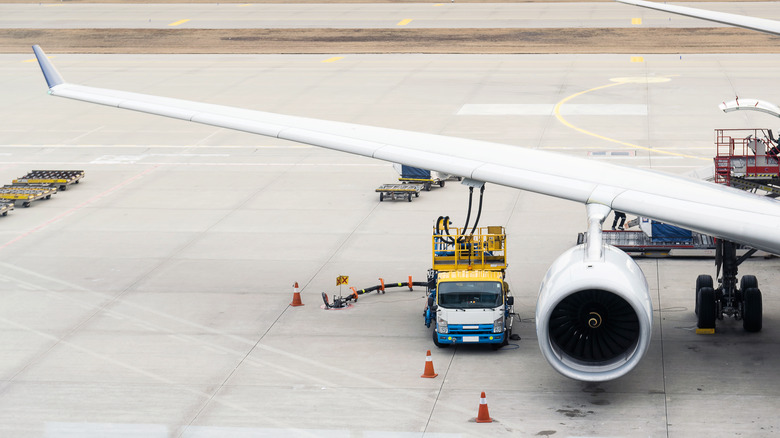 An aircraft being refuelled before take off.