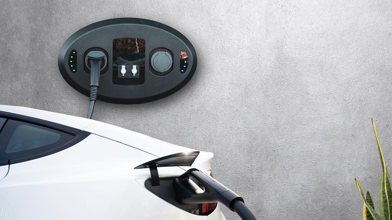 Tesla plugged in wall charger