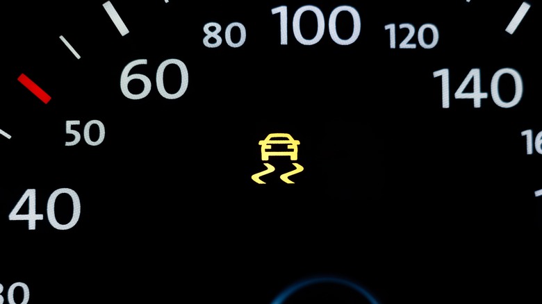 Car interior gauge showing traction control light