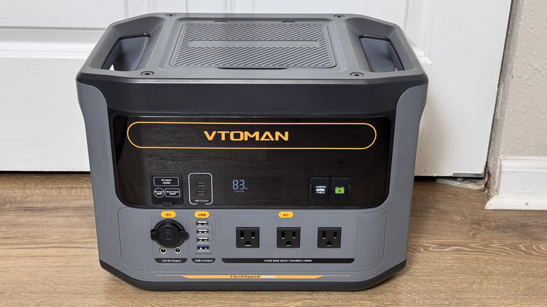 The VTOMAN FlashSpeed 1500 on a wood floor showing the top angle and front ports.