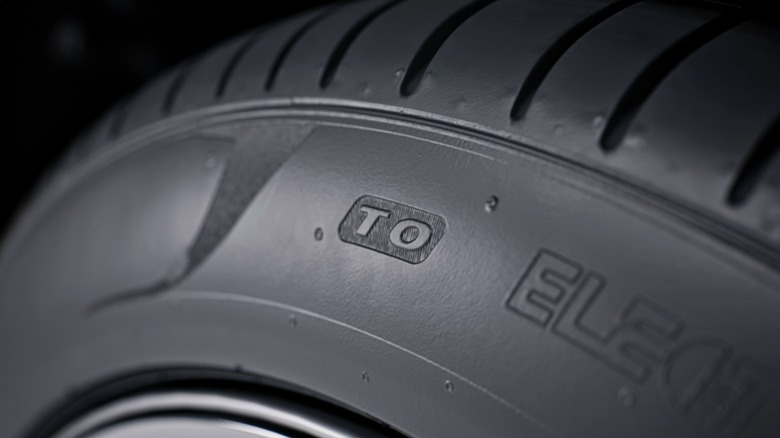 Tesla approved tire symbol T0