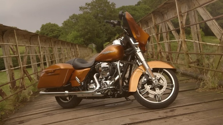 A 2014 Harley-Davidson Street Glide motorcycle parked on wooden bridge