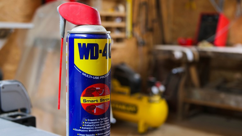 Can of WD-40 on a surface