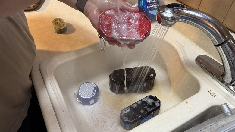 Washing four speakers in a sink