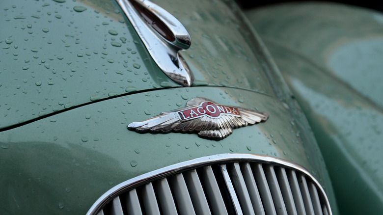 Lagonda logo closeup on wet car