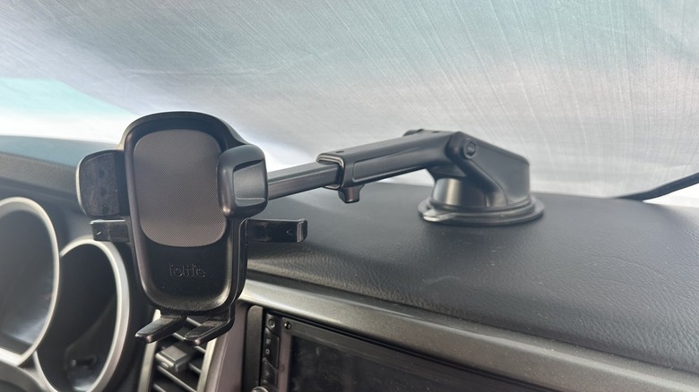 An older generator phone mount attached to a dashboard