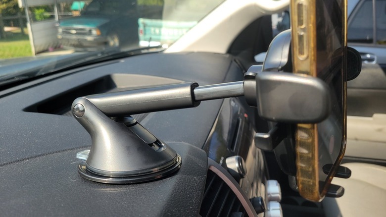 A side profile of a phone mount on a dashboard