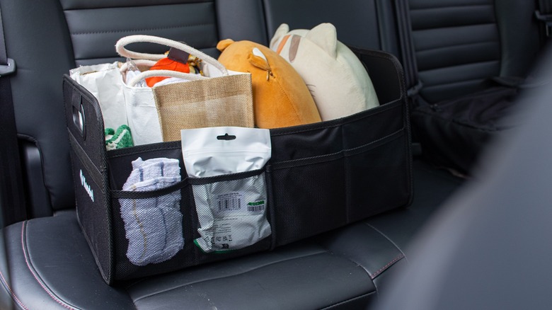 Car trunk organizer in backseat