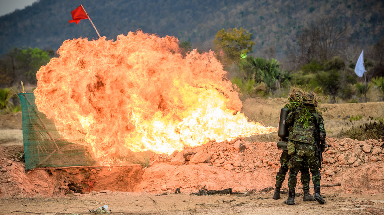 Soldiers using a flamethrower