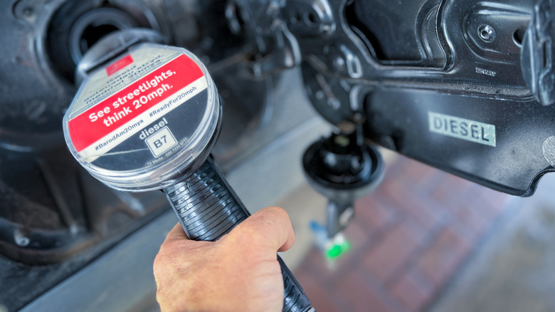 Diesel vehicle being filled at pump