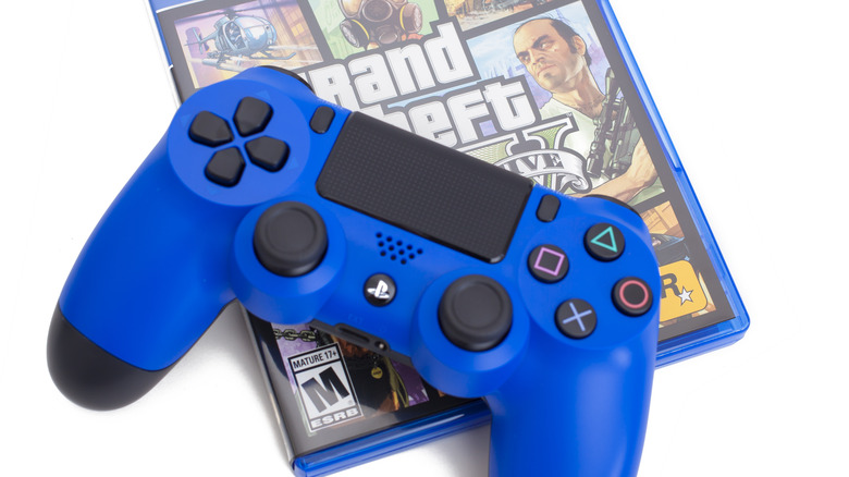 blue PS4 controller with GTA disc