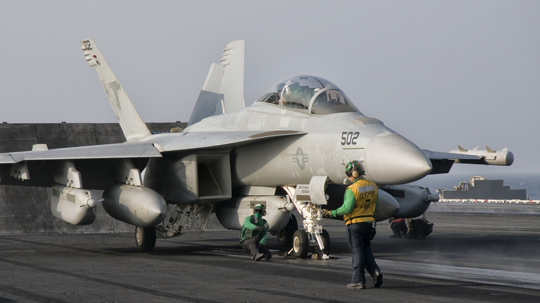 EA-18 Growler on an aircraft carrier getting ready to takeoff