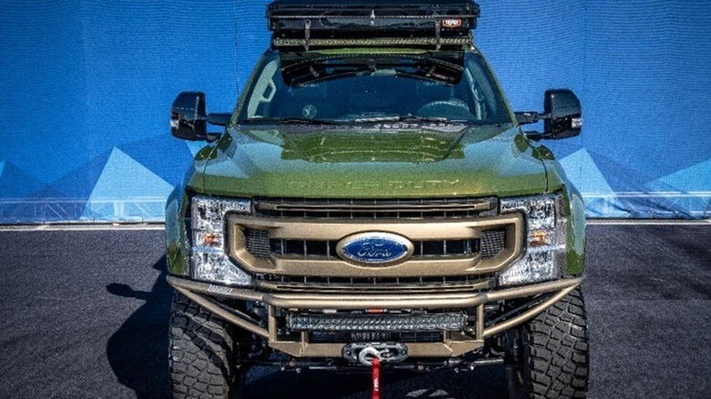 Green F-250 with accessories