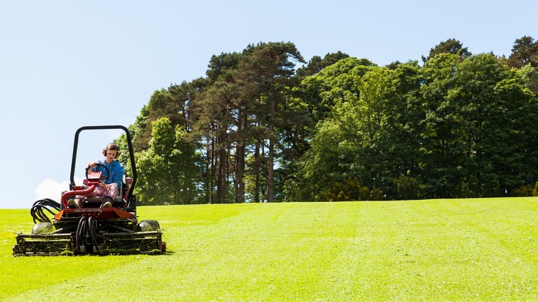 Mowing a large lawn with a riding mower