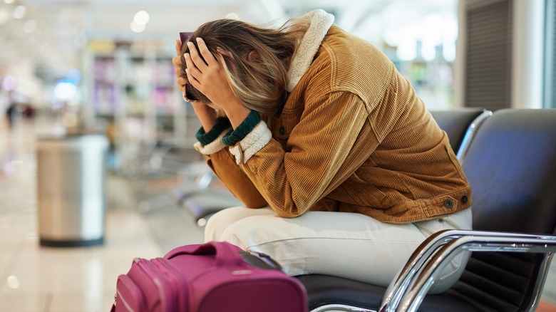 woman upset at airport