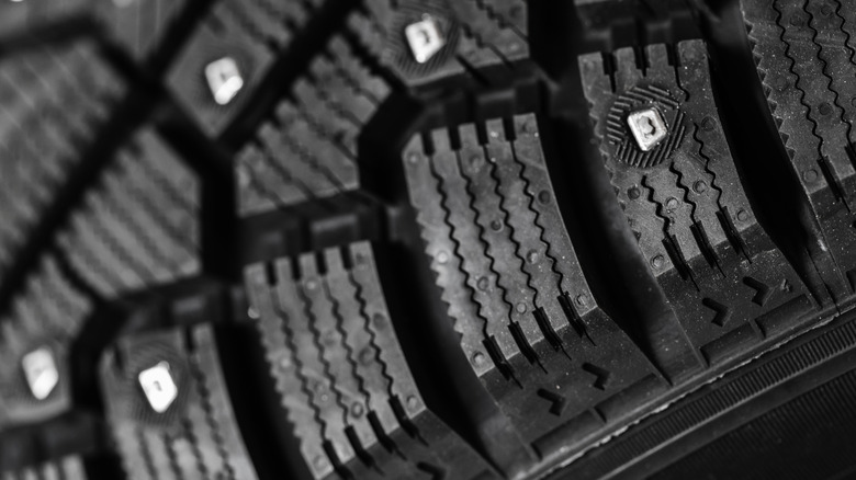 A closeup of a studded tire