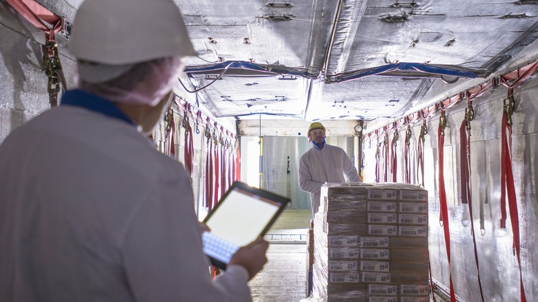 Personnel loading up a reefer