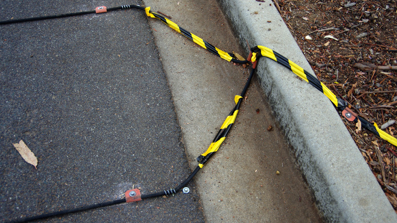 two pneumatic road tubes placed on the road.