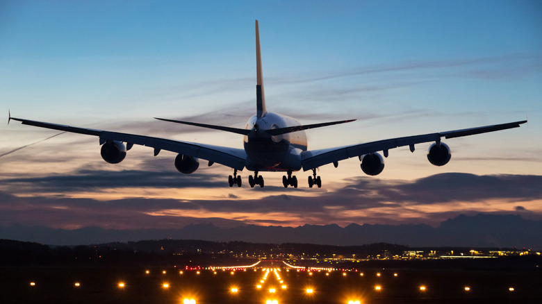 Passenger jet about to land on a runway