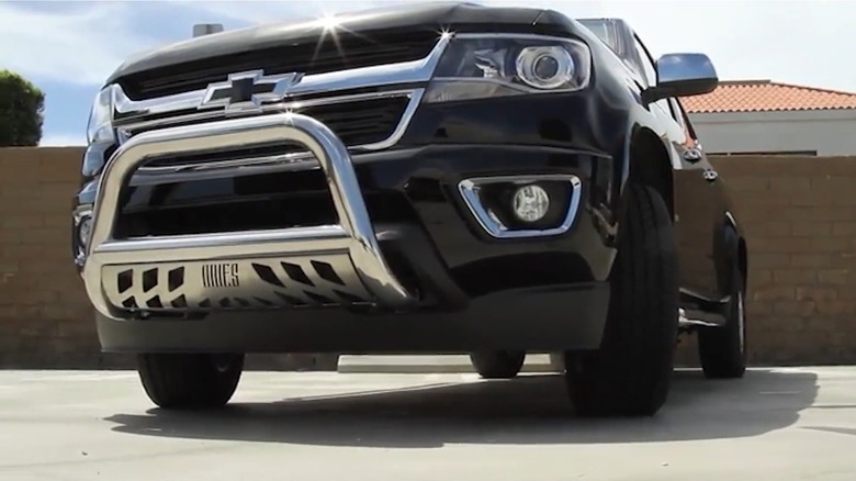 A black Chevy Truck With A Bull Bar