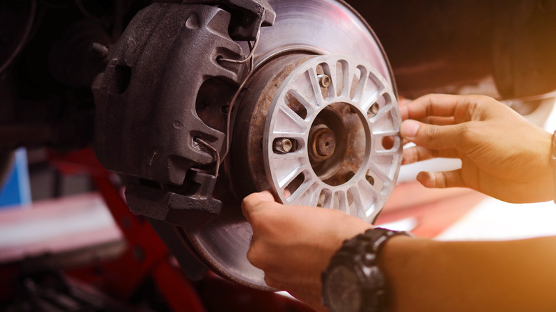 Wheel spacer being fitted to a vehicle hub