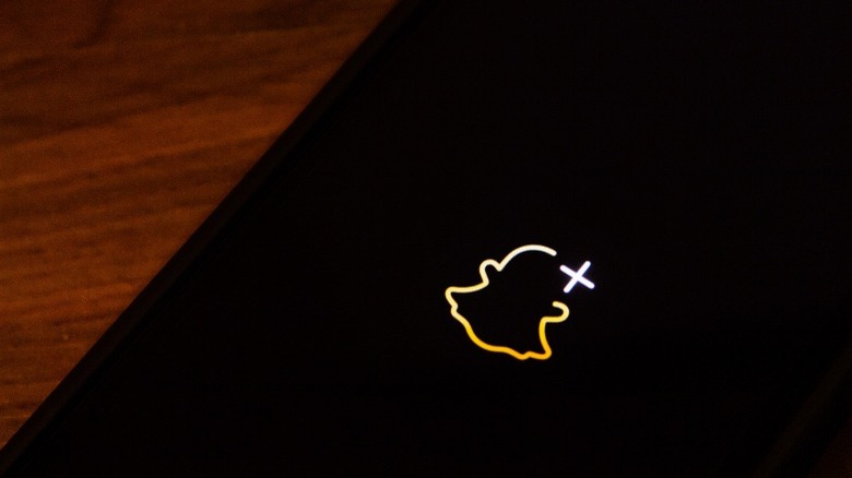 Snapchat + logo on a phone