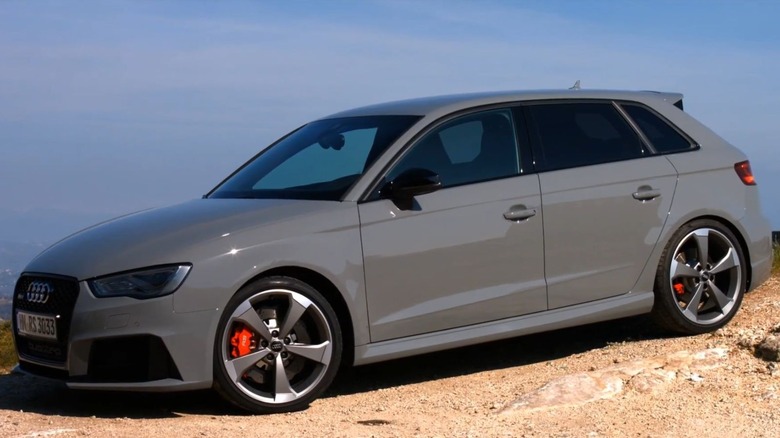 A grey RS3 8V parked on a hill