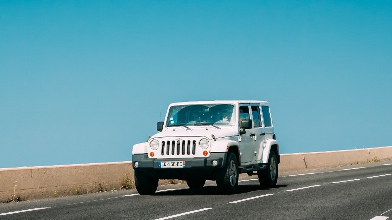 White Jeep Wrangler on the road