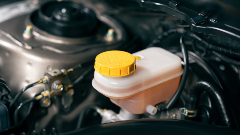 Brake fluid tank filled with clean brake fluid.