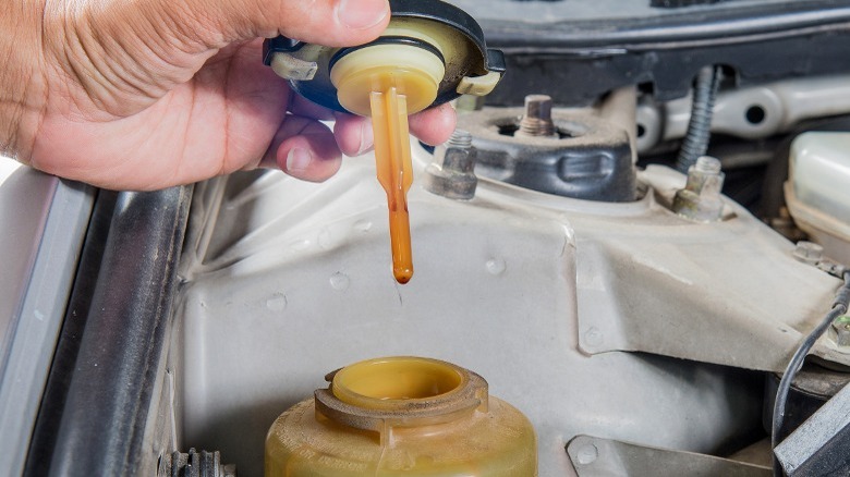 cap removed from power steering fluid reservoir