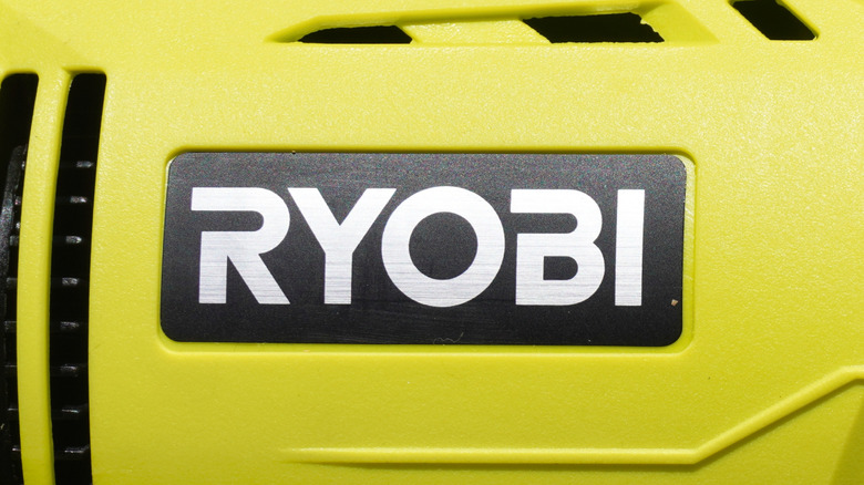 The Ryobi logo on the side of a power tool.