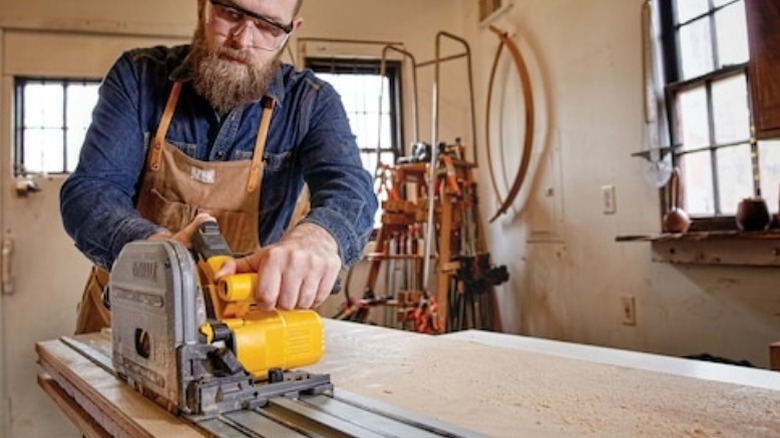 Person using Dewalt track saw