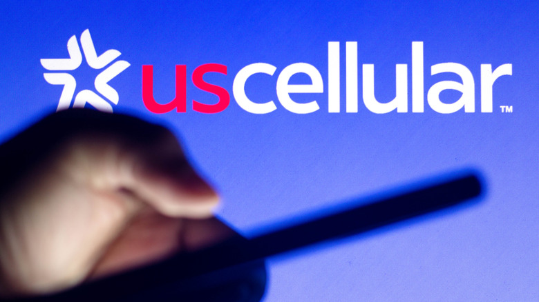 U.S. Cellular logo and person using phone