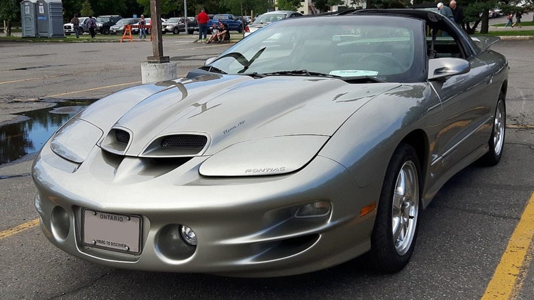 Parked silver Pontiac Trans Am