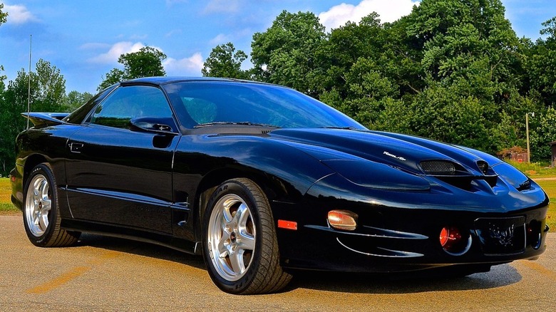 Black 2002 Pontiac Trans Am parked