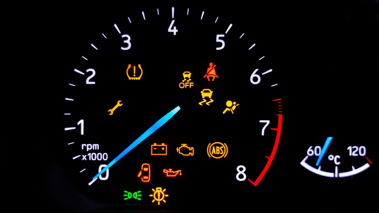 Car dashboard with warning lights