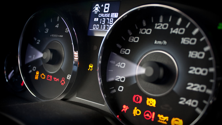 car dashboard with warning lights on