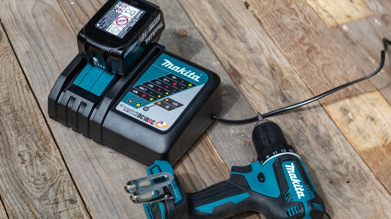 Makita drill next to rapid charger