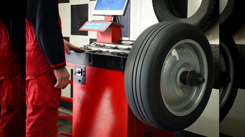 A Tire Balancing Machine And Technician