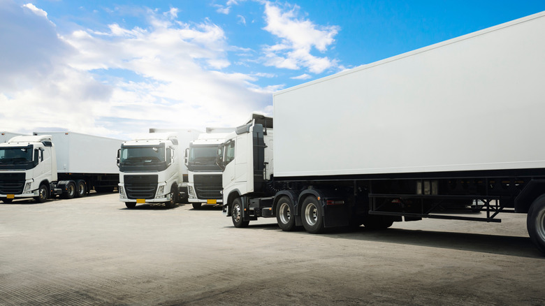 White semi-truck trailers in a parking lot