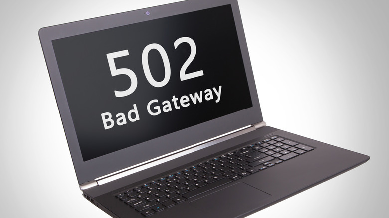 A laptop showing a 502 bad gateway on the screen